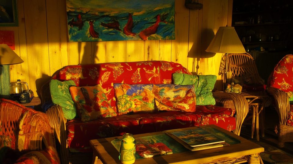 A cozy living room with soft lighting, a thrifted coffee table. ai generated